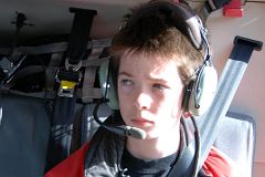 02 Peter Ryan In Helicopter As It Takes Off From Canmore Towards Mount Assiniboine In Winter